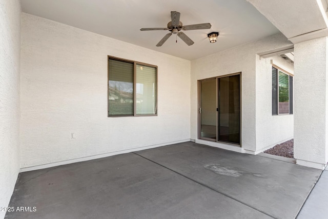 view of patio featuring ceiling fan