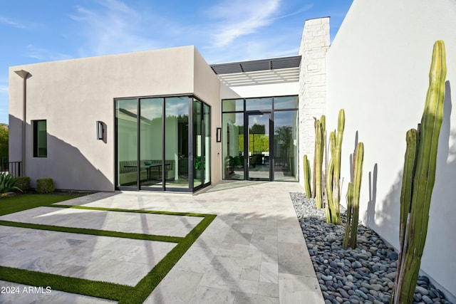 6862 E Joshua Tree Ln, Paradise Valley, AZ 85253 - rear view of property with a patio and stucco siding
