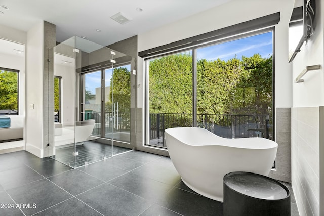 6862 E Joshua Tree Ln, Paradise Valley, AZ 85253 - full bath featuring tile patterned flooring, a soaking tub, and healthy amount of natural light