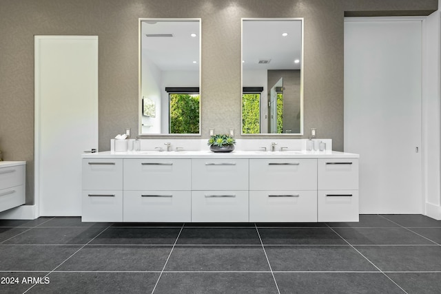 bathroom with tile patterned flooring and vanity