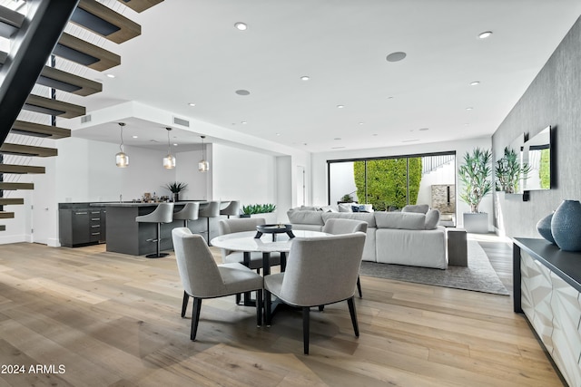 dining space featuring light wood-type flooring