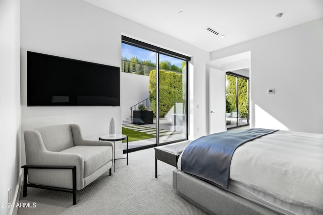 bedroom featuring carpet floors and access to outside