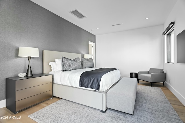 bedroom with light hardwood / wood-style flooring