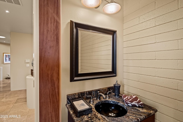 bathroom featuring tile patterned flooring, visible vents, and vanity