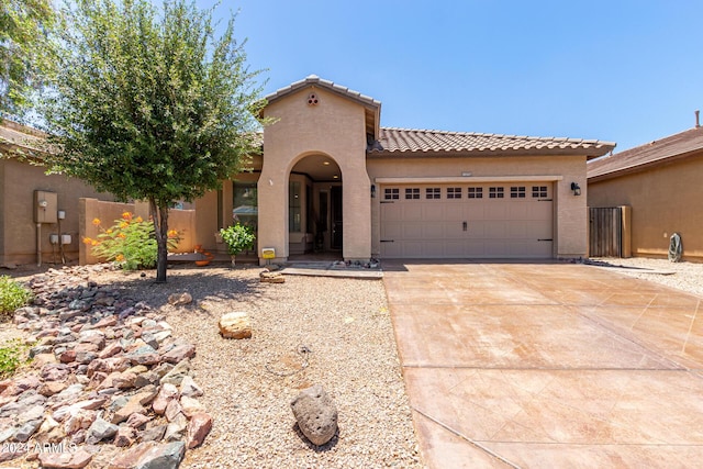 mediterranean / spanish-style house featuring a garage