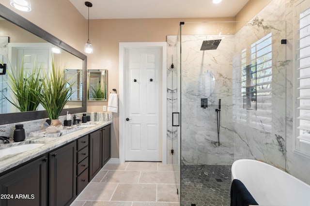 bathroom featuring separate shower and tub and vanity