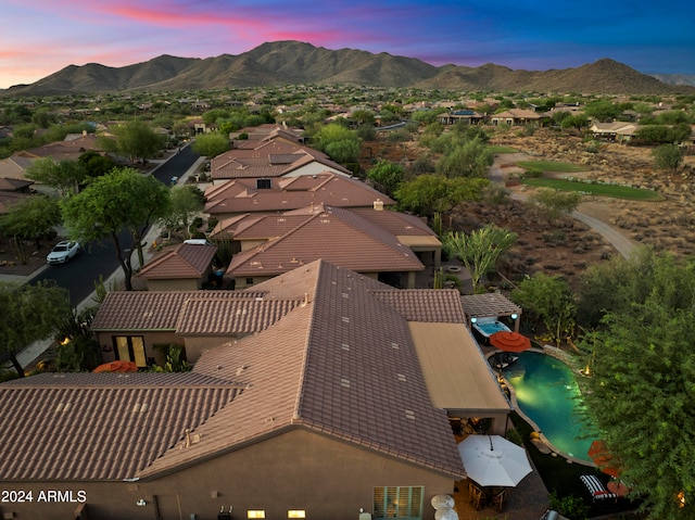 aerial view at dusk with a mountain view