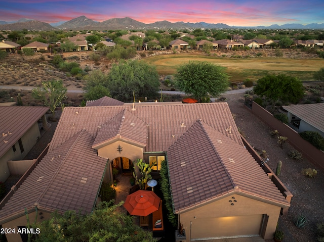 aerial view at dusk with a mountain view