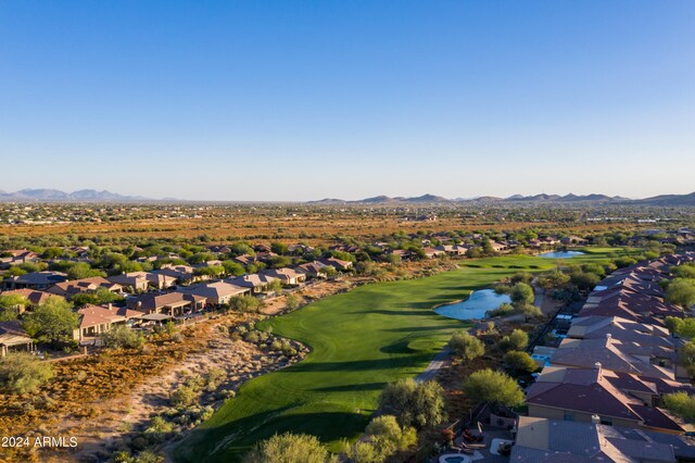 drone / aerial view featuring a water and mountain view