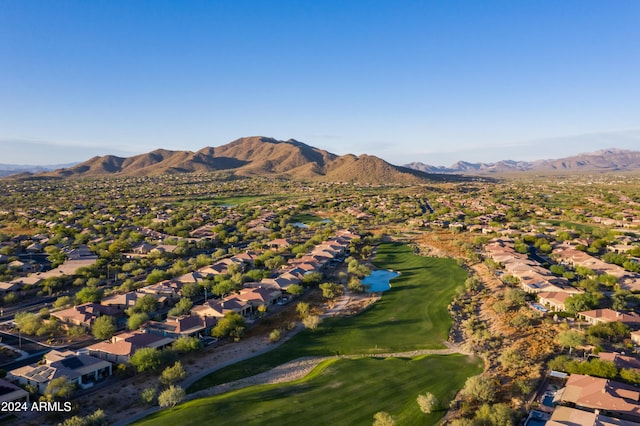 birds eye view of property with a mountain view