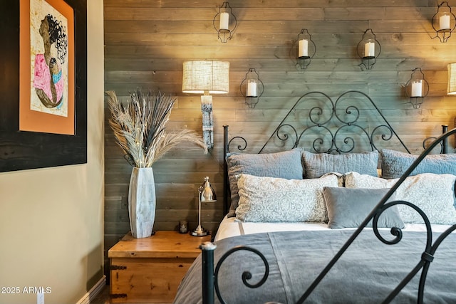 bedroom with wood walls