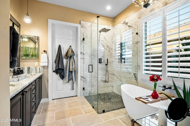 bathroom with separate shower and tub and vanity