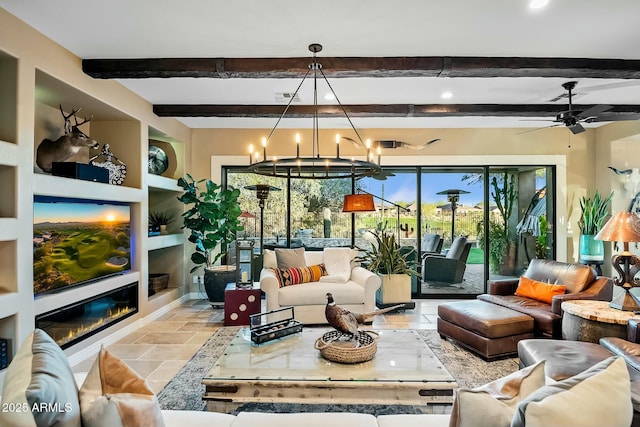 living room with beam ceiling, built in features, and ceiling fan with notable chandelier