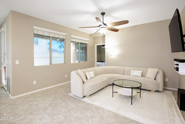 9295 W Wood Dr, Peoria, AZ 85381 - living area with light tile patterned floors, baseboards, and a ceiling fan