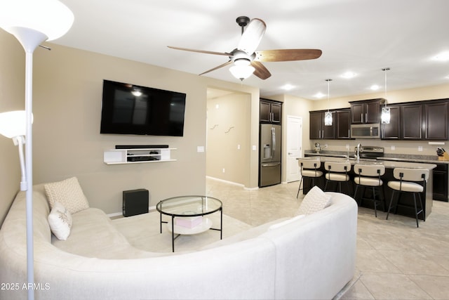 9295 W Wood Dr, Peoria, AZ 85381 - living area with light tile patterned floors, a ceiling fan, and recessed lighting