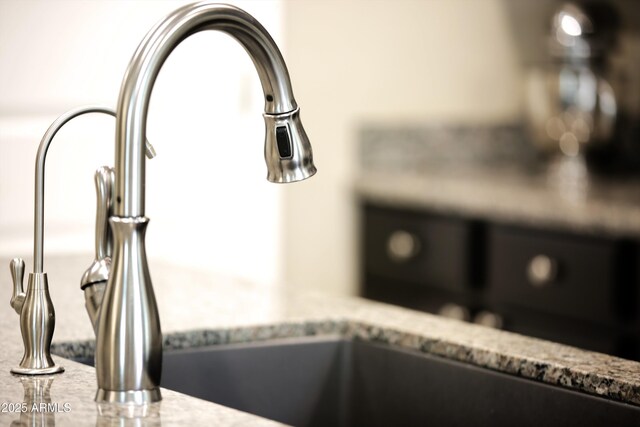9295 W Wood Dr, Peoria, AZ 85381 - details with light stone counters and a sink