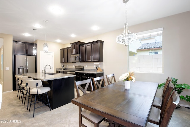 9295 W Wood Dr, Peoria, AZ 85381 - dining space with light tile patterned flooring, recessed lighting, and a chandelier
