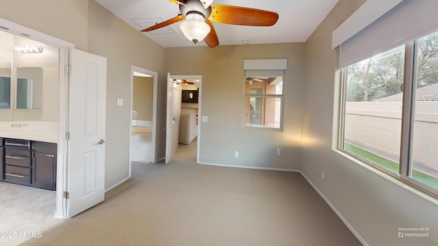 9295 W Wood Dr, Peoria, AZ 85381 - unfurnished bedroom with light carpet, ensuite bath, and baseboards