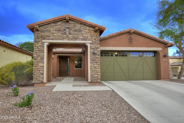 9295 W Wood Dr, Peoria, AZ 85381 - view of front facade with stone siding, stucco siding, driveway, and a garage