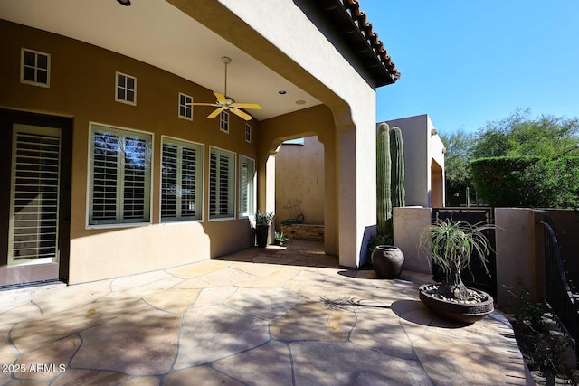 view of patio featuring ceiling fan