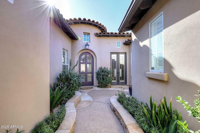 entrance to property featuring french doors