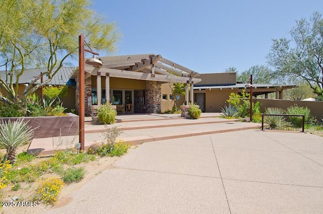 view of front of house with a patio and a pergola