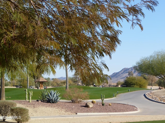 view of property's community featuring a mountain view, a gazebo, and a lawn