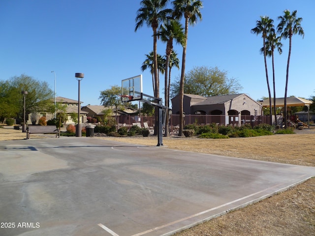 view of sport court featuring community basketball court and fence