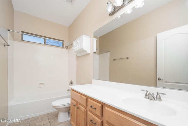 bathroom featuring vanity, bathing tub / shower combination, tile patterned flooring, and toilet