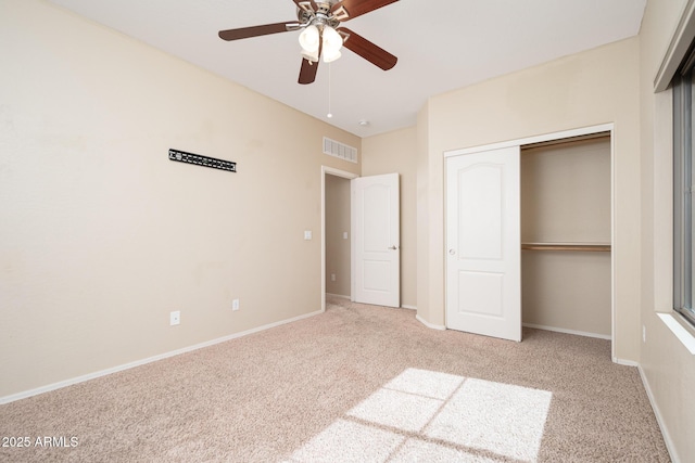 unfurnished bedroom featuring carpet floors, a ceiling fan, visible vents, baseboards, and a closet