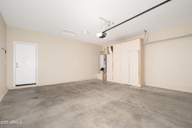 garage featuring baseboards, a garage door opener, and electric water heater