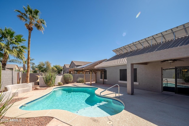 view of pool with ceiling fan, a patio, a fenced backyard, a fenced in pool, and a pergola