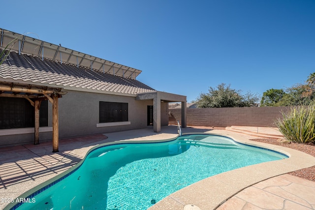 view of pool featuring a patio area, a fenced backyard, and a fenced in pool