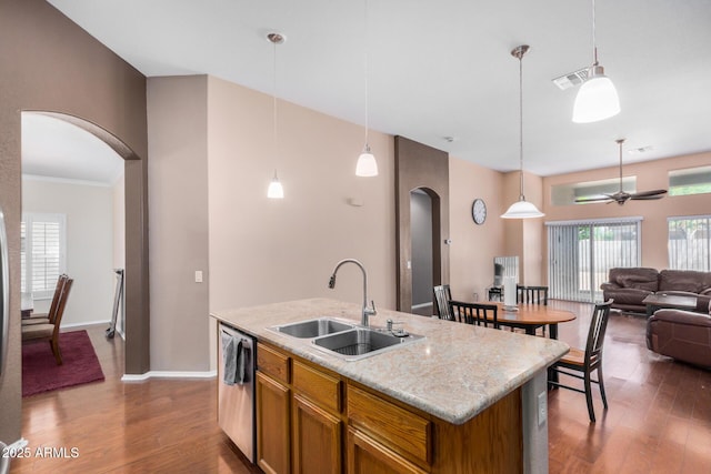 726 E Heather Dr, San Tan Valley, AZ 85140 - kitchen with arched walkways, a sink, dishwasher, pendant lighting, and dark wood-style flooring