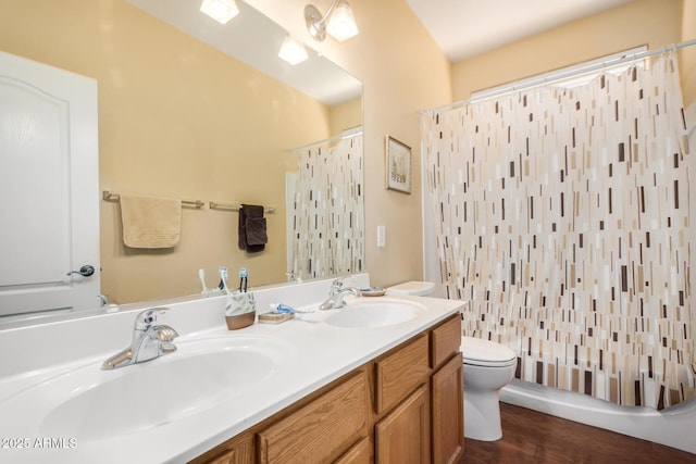 726 E Heather Dr, San Tan Valley, AZ 85140 - bathroom featuring toilet, double vanity, curtained shower, and wood finished floors