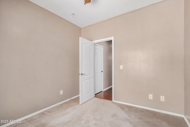 726 E Heather Dr, San Tan Valley, AZ 85140 - unfurnished bedroom with baseboards and carpet flooring