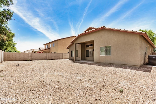 726 E Heather Dr, San Tan Valley, AZ 85140 - rear view of house featuring stucco siding, central air condition unit, a tile roof, a fenced backyard, and a patio area