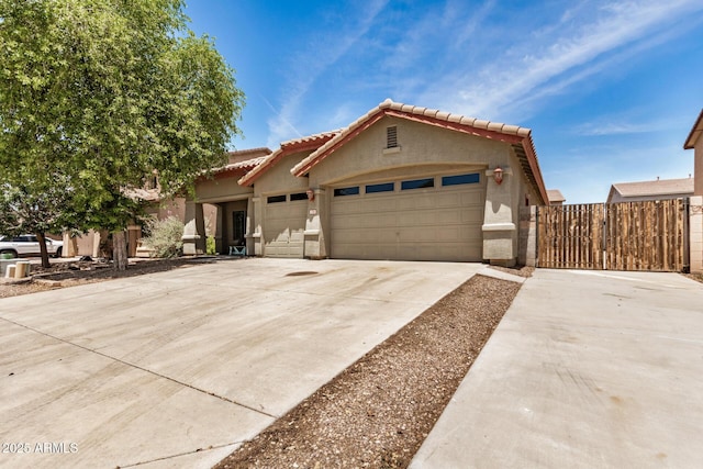 726 E Heather Dr, San Tan Valley, AZ 85140 - view of front of home featuring an attached garage, a tiled roof, driveway, and stucco siding