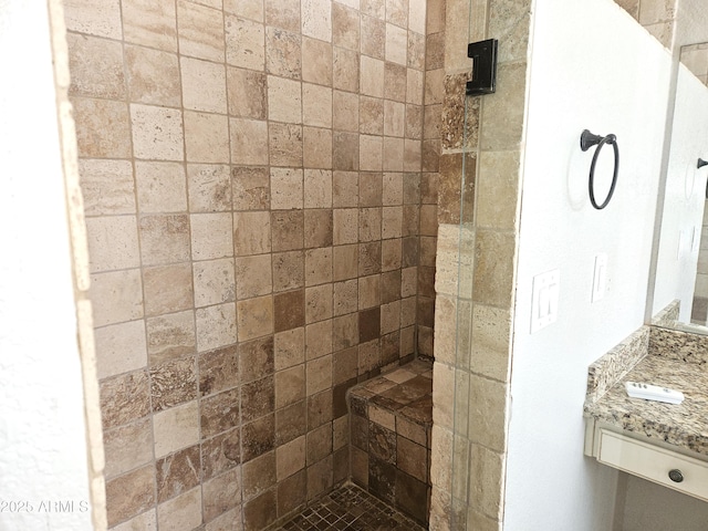 bathroom with tiled shower