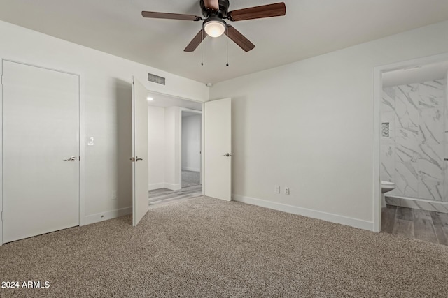 unfurnished bedroom with carpet, ceiling fan, and ensuite bath