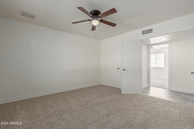 spare room with ceiling fan and light hardwood / wood-style floors