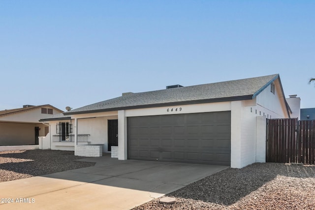 ranch-style home with a garage