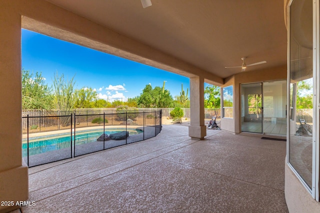 view of patio featuring a fenced in pool, a fenced backyard, and ceiling fan