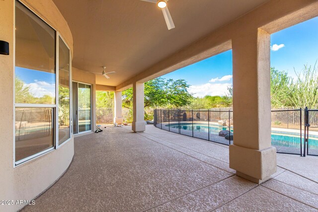 view of patio / terrace featuring a fenced in pool, a fenced backyard, and ceiling fan