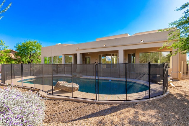 view of swimming pool featuring a fenced in pool, a patio area, and fence