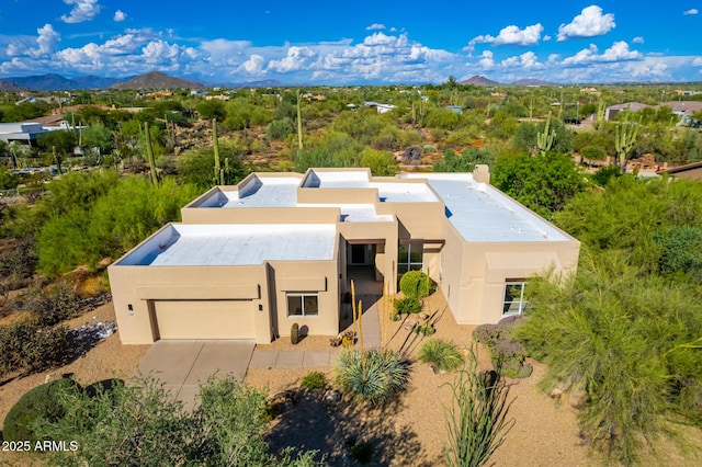 birds eye view of property with a mountain view