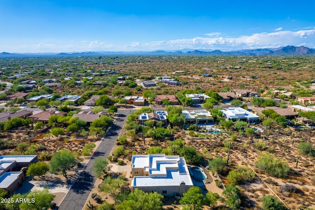 birds eye view of property with a mountain view and a residential view