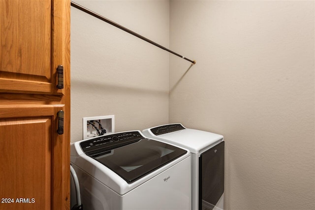 washroom with independent washer and dryer