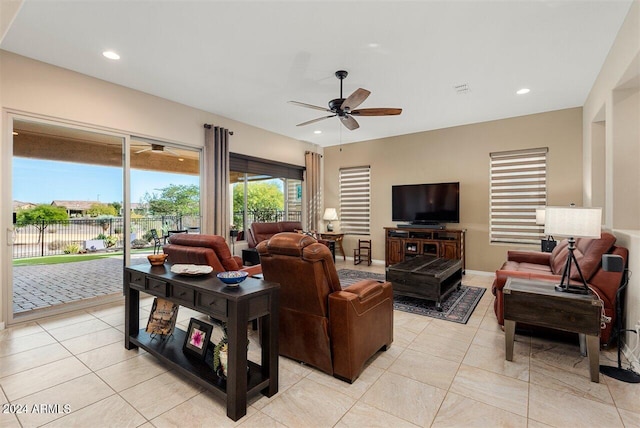 living room with ceiling fan and light tile patterned flooring