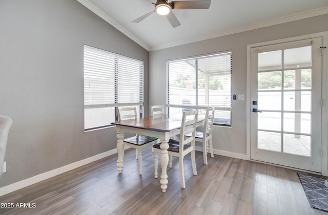 dining room with ceiling fan, wood finished floors, baseboards, and ornamental molding